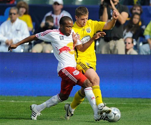 New York Red Bulls midfielder Dane Richards, left and Columbus Crew midfielder Robbie Rogers both get a foot on the ball during the first half of the MLS Cup soccer match Sunday, Nov. 23, 2008, in Carson, Calif. 